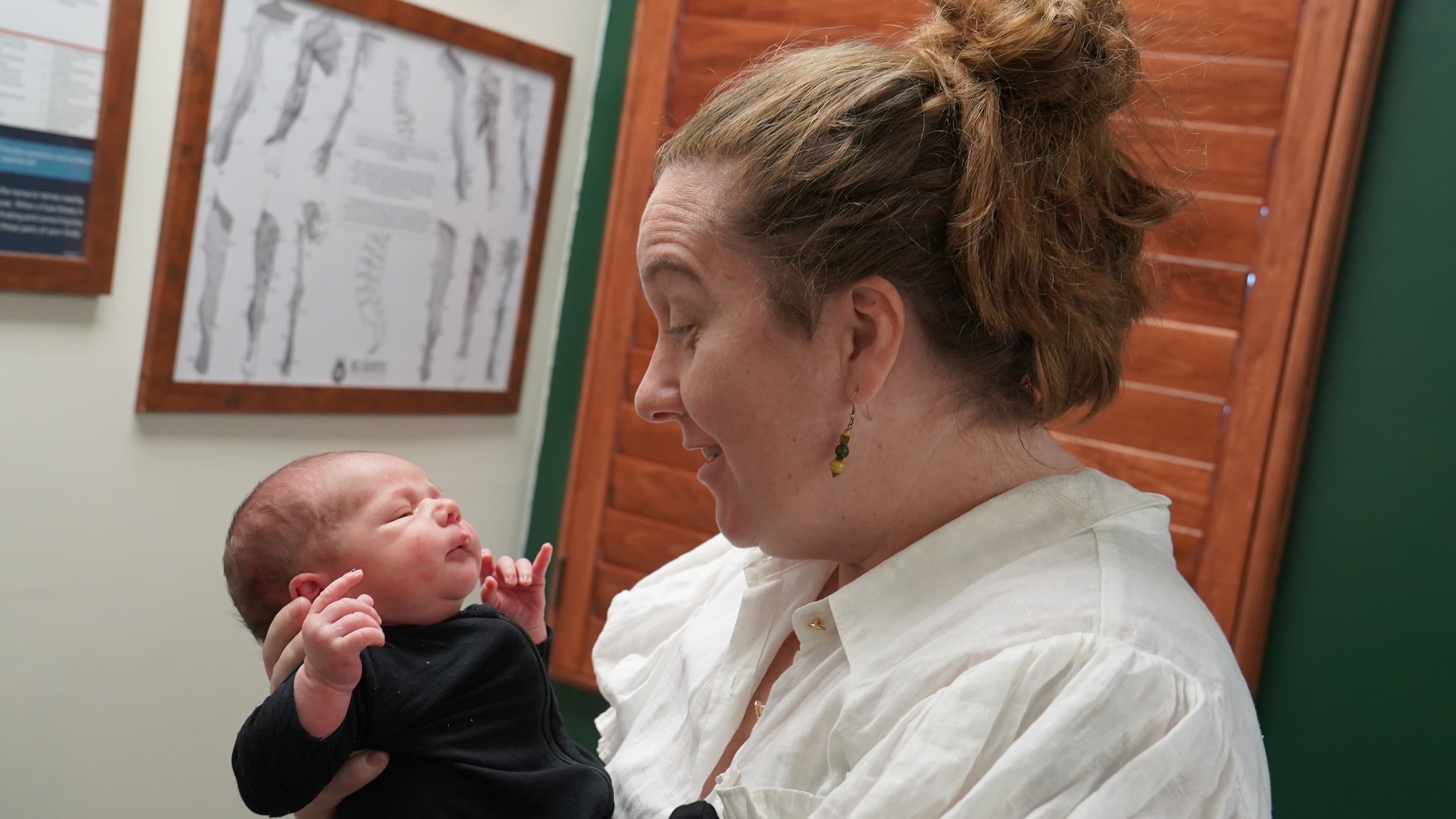 Dr. Bridget Farrar with a newborn at Sláinte Chiropractic